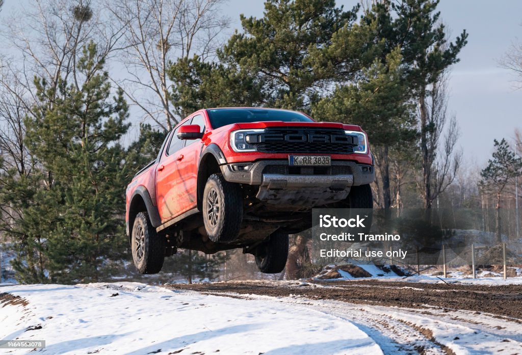 Ford Ranger Raptor jumping while driving Berlin, Germany - 6th February, 2023: Ford Ranger Raptor jumping while driving on a road. The Ranger is one of the most popular pickup vehicles in Europe. 2023 Stock Photo