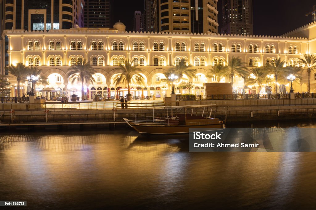 Sharjah urban cityscape skyline night scene., Al Qasba canal in Sharjah, United Arab Emirates Al Qasba canal in Sharjah, United Arab Emirates Arabia Stock Photo