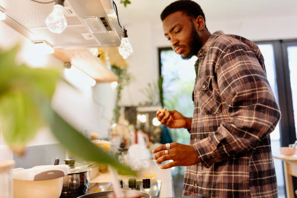 istock African American man eating in the kitchen 1464563936