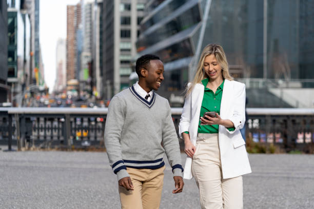 istock Co-workers in a casual conversation outdoor 1464565566