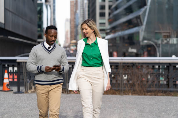 istock Co-workers in a casual conversation outdoor 1464565568