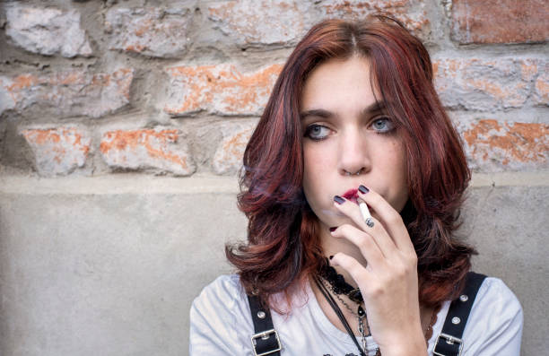 istock Gen Z girl smoking a cigarette 1464567436