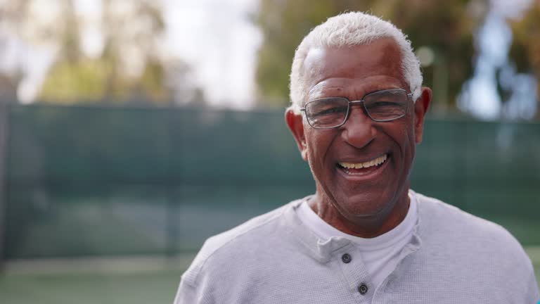 Portrait of a senior black man on the tennis court