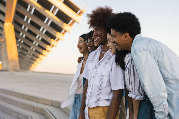 istock Group of multi ethnic friends outdoors enjoying panoramic view taking photos colleagues 1464568497