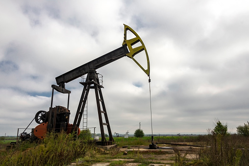 An oil pump draws oil from the bowels of the earth.