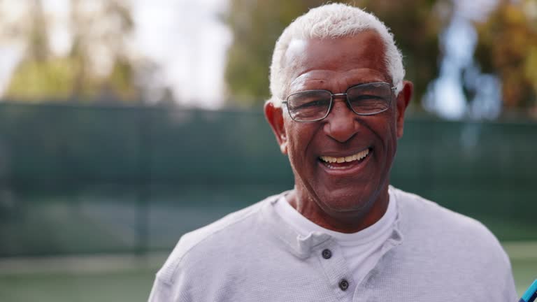 Portrait of a senior black man on the tennis court