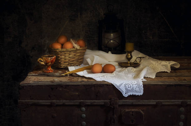 istock Easter eggs, candles and censer on a wooden chest 1464571963