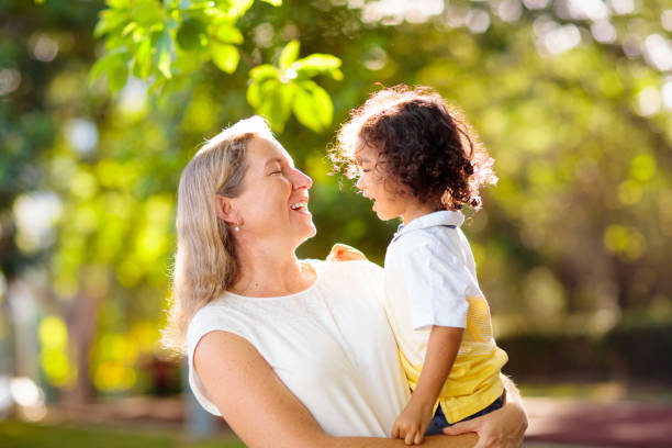 istock Mother and son in sunny park. 1464572560
