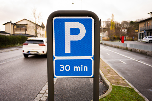 Gothenburg, Sweden - november 13 2022: Sign allowing for max 30 minutes of free parking.