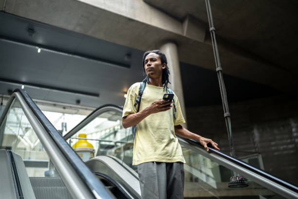 istock Young man on the escalator in the subway station 1464578209