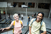 Portrait of friends on the escalator in the subway station