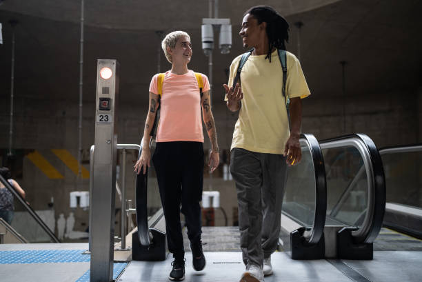 istock Friends talking on the escalator in the subway station 1464578378