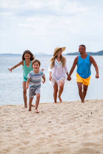 istock Family walk on the beach. 1464578696