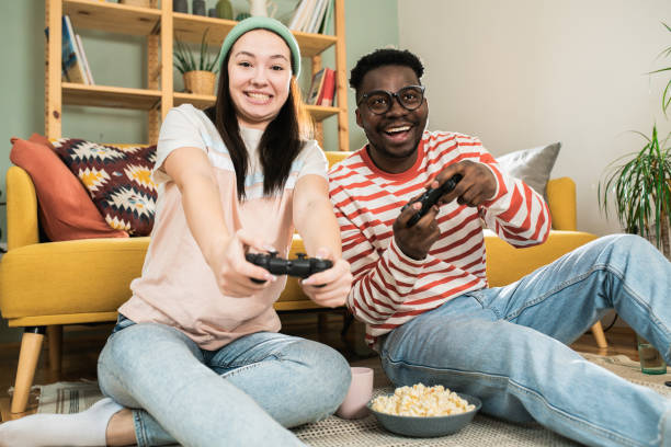 istock Happy couple gaming at home 1464578857