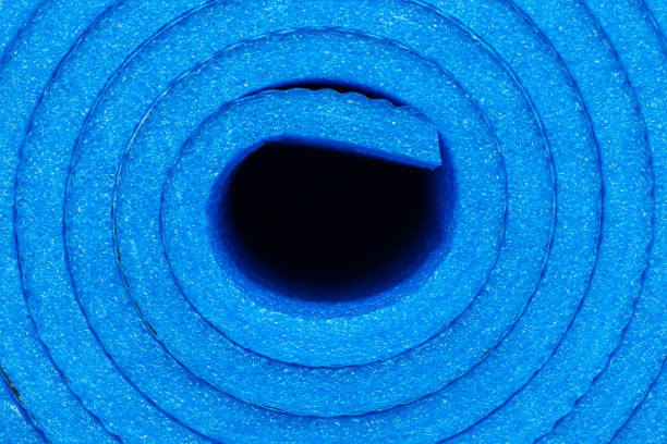 Rolled-up lightweight foam yoga mat