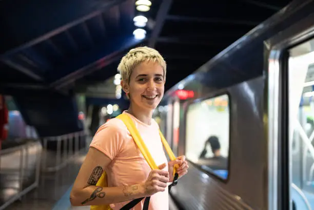 Portrait of a young woman in the subway station