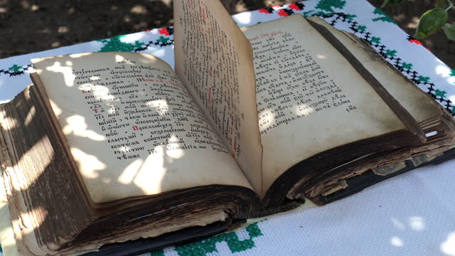 Timeless Pages of an Old Book Rolling on a Table
