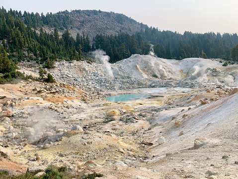 Bumpass Hell, Lassen volcano national park. Hydrothermal area with a trail past mud pots, fumaroles, boiling springs, and mountain views