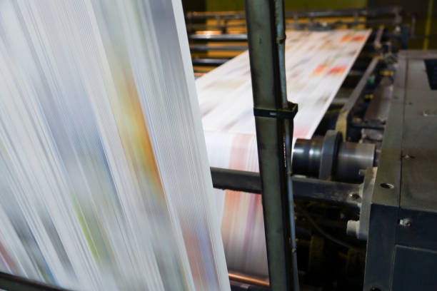 istock Newspaper printing press in a printing plant 1464586644