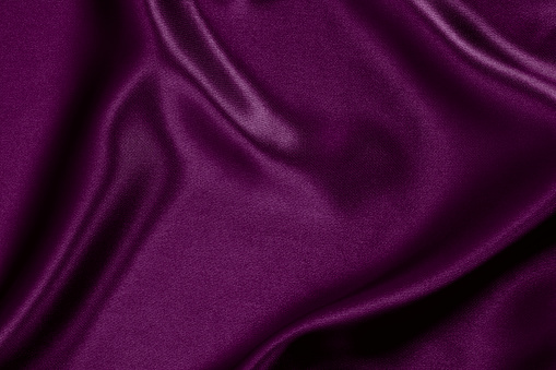 Purple satin wavy background.