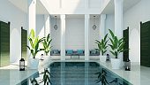 Modern luxury riad living room garden and swimming pool in courtyard, morocco style