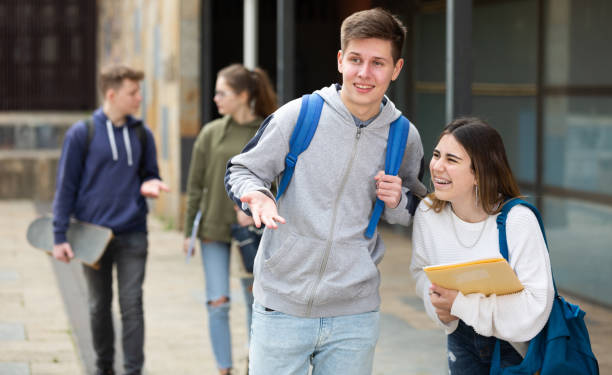 istock Cheerful teenagers talking outside after lessons 1464593440