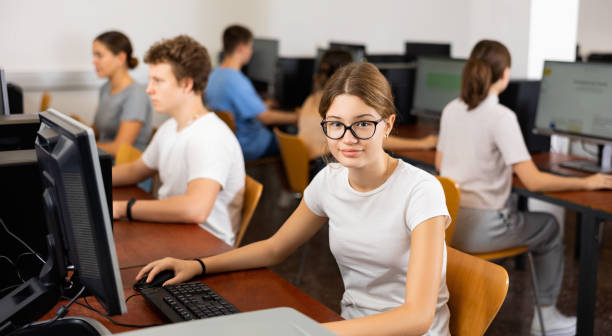 istock Portrait of positive smart girl in computer class 1464593993