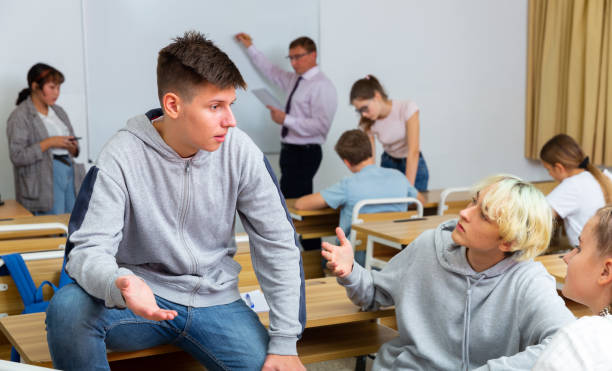 istock Teenage students talking during recess between lessons 1464594732
