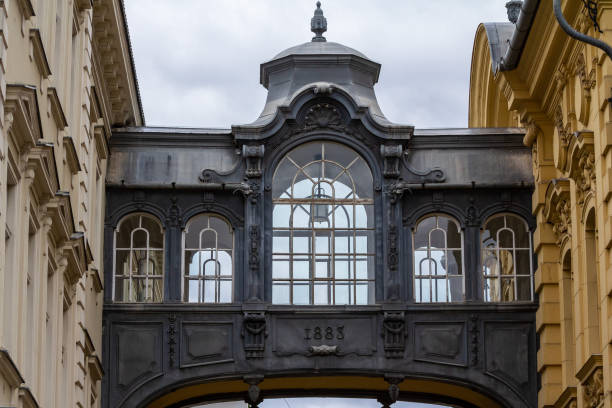 istock Focus on a skyway bridge, a bridge connecting two buildings, with a typical austro hungarian architecture, in the city center of Timisoara, Romania. 1464595968