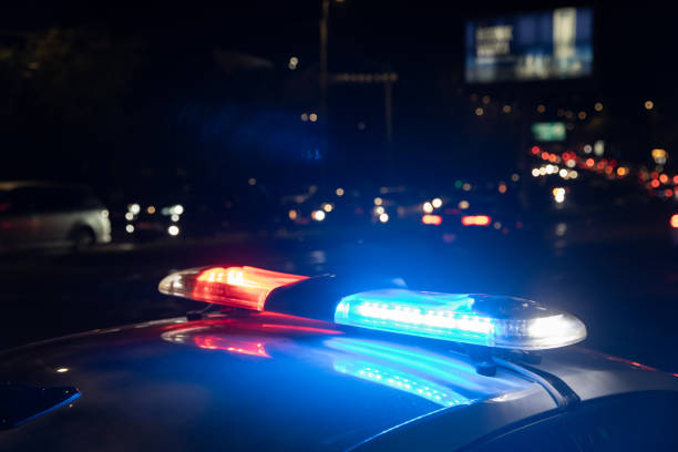istock Police car with flashing lights on 1464597595