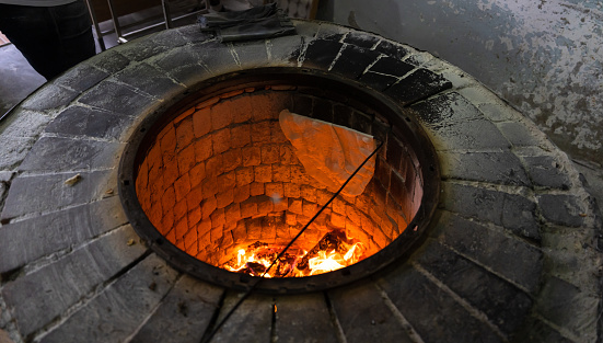 Lavash is cooked in the tandoor. bread cooking
