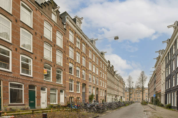 istock a row of bikes parked in front of a building 1464598693