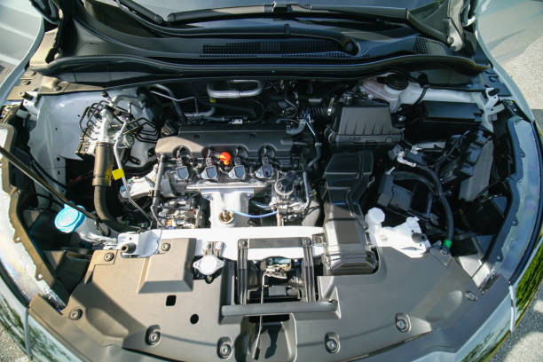 istock Car garage services concept. Engine and battery scanning and check, automotive diagnostic injector throttle, alternator, manifold in motor compartment. Examining the valve cover and gasket. 1464598747