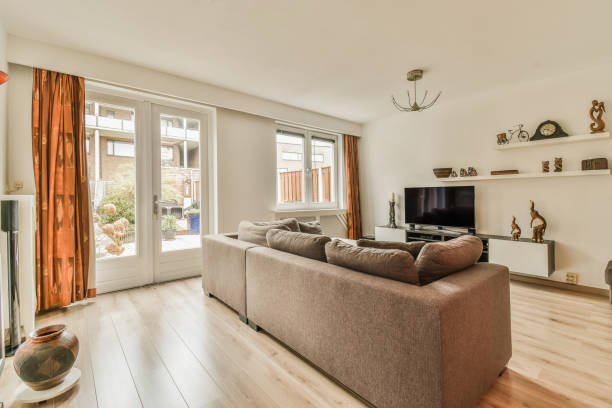 istock a living room with a couch and a tv 1464598853
