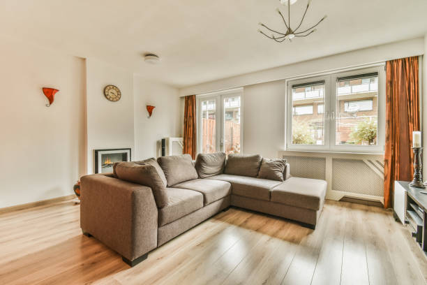 istock a living room with a couch and a large window 1464599678