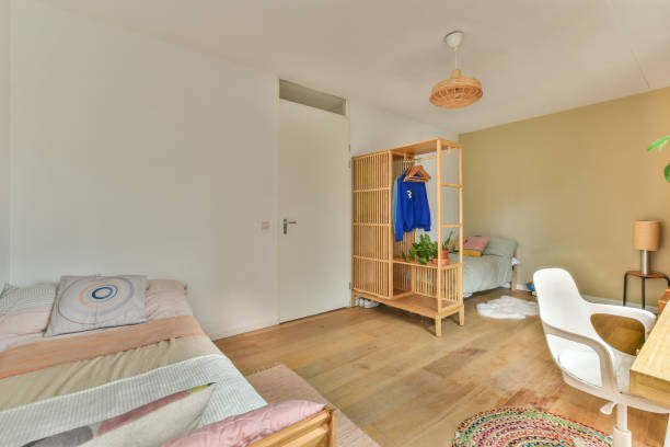 istock a bedroom with a bed and a closet 1464601795