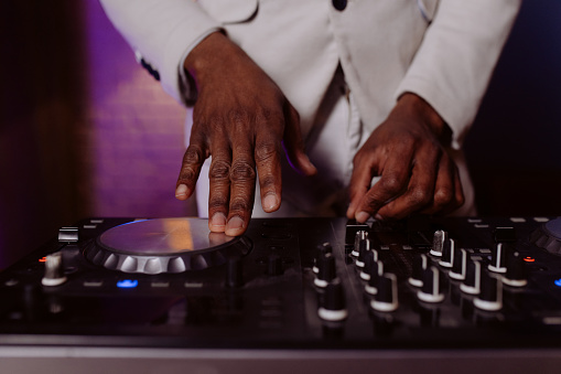 Details of the DJ's console at a a salsa party indoors