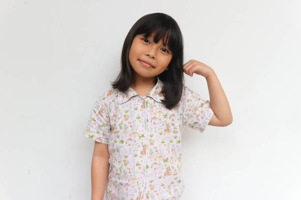 istock Smiling Asian children showing her strong hands or muscle 1464603347