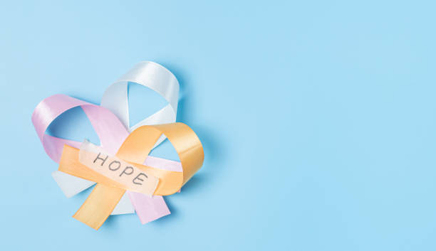 istock Three ribbons with the word hope on a blue background. 1464607229