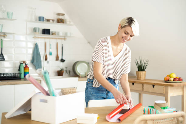 istock Young girl is preparing gifts 1464608080