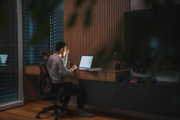 istock Young Multiracial Businessman Working at Night from Home Office 1464608121