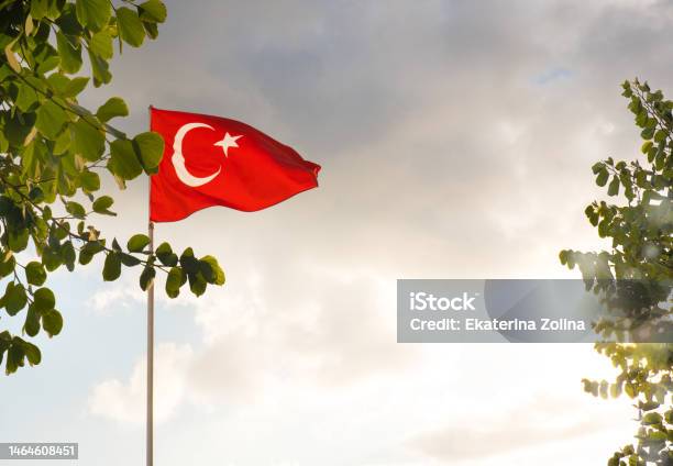 The Flag Of Turkey Is Developing In The Blue Sky Stock Photo - Download Image Now - Backgrounds, Blue, Cloud - Sky