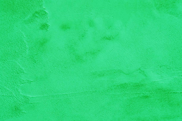 istock Surface of green shabby plaster on the wall. 1464608464