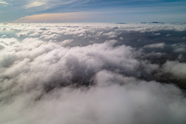 istock Fog over the mountains at sunset, aerial view. 1464609753