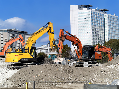 A construction site for building a large-scale building. Foundation work with a power shovel.