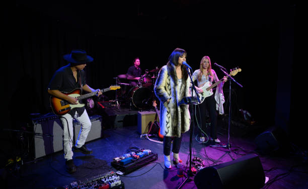 istock Female Singer Performing with Her Band 1464613347