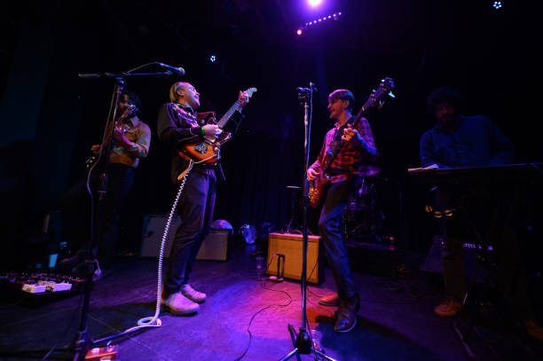 istock Rock Band Performing Live On Stage 1464613392