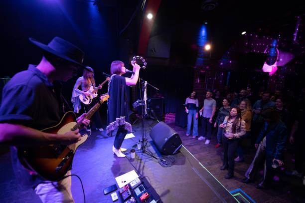 istock Rock Band Playing for Audience at Small Venue 1464613416