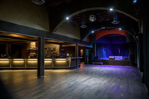 Empty Music Venue with Stage and Bar