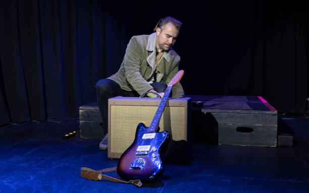 Musicians preparing for a show in a small venue.